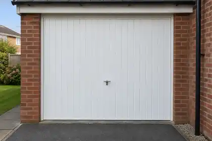 Up-and-over garage door with a central locking handle.