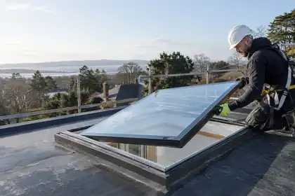 Glazier replacing rooflight glass