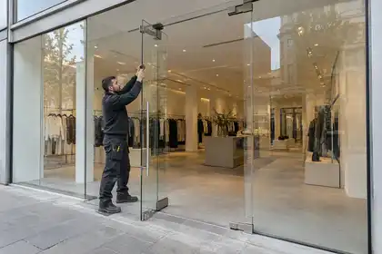 Illustrative Safety and Security Film Replacement scene: Frameless glass shopfront installation.